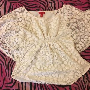 Cream colored, lace top.